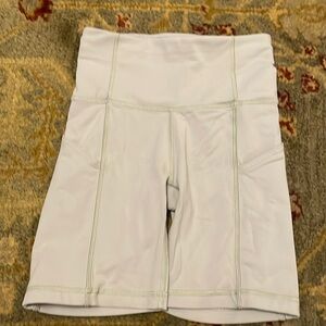 TnaLIFE (Aritzia)  7” inseam sage green pocket bike shorts XS